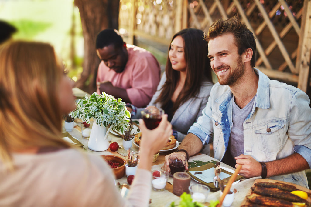 Friends around the table enjoying a meal